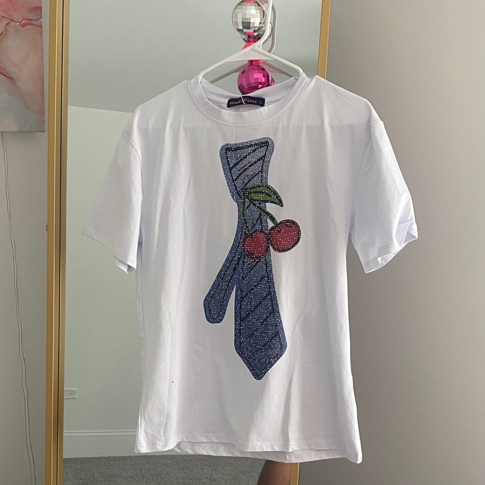 White T-Shirt with Blue Tie and Cherry Design